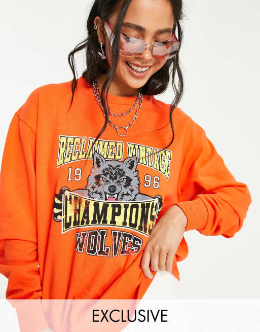 Sweat champion orange femme 2025