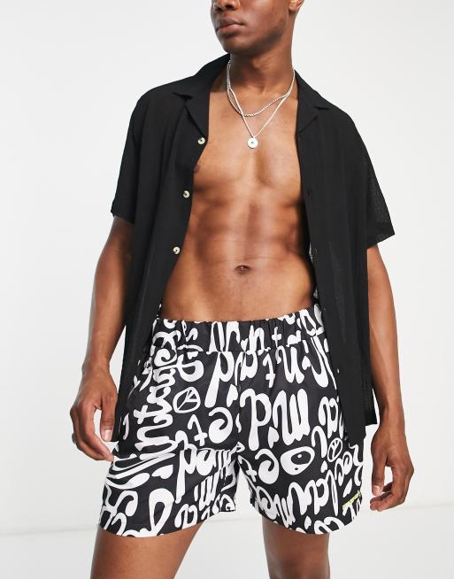 Reclaimed Vintage Inspired swim shorts in mono trippy logo print