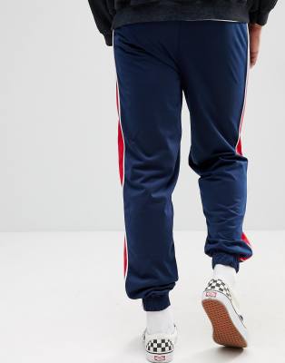 navy blue pants with red stripe