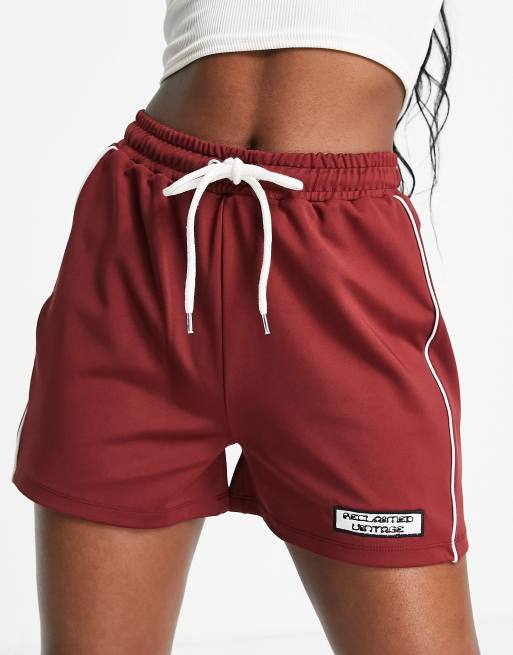 Reclaimed Vintage inspired track shorts with side stripe with burgundy
