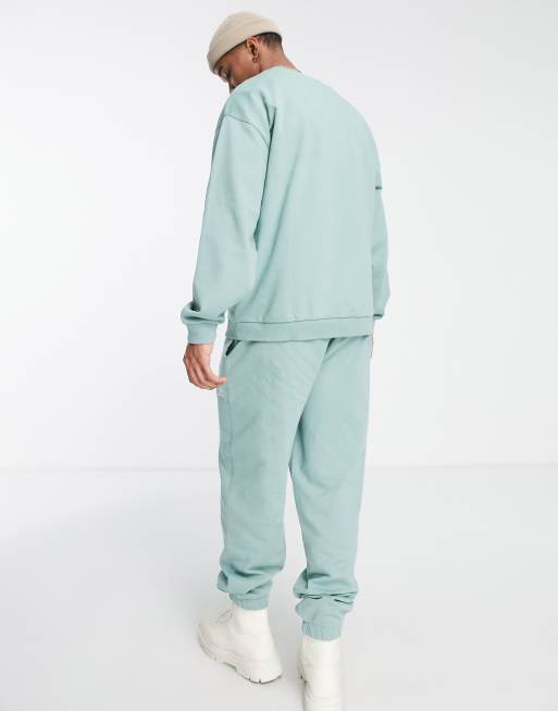 Reclaimed Vintage Inspired unisex relaxed joggers with pastel rainbow embroidery in sage part of a set