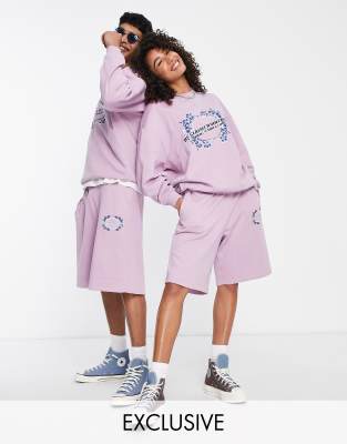 Reclaimed Vintage inspired unisex shorts with surf graphic in purple  - ASOS Price Checker