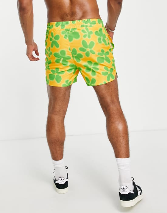 https://images.asos-media.com/products/reclaimed-vintage-inspired-unisex-swim-short-in-yellow-flower-print/201844105-2?$n_550w$&wid=550&fit=constrain