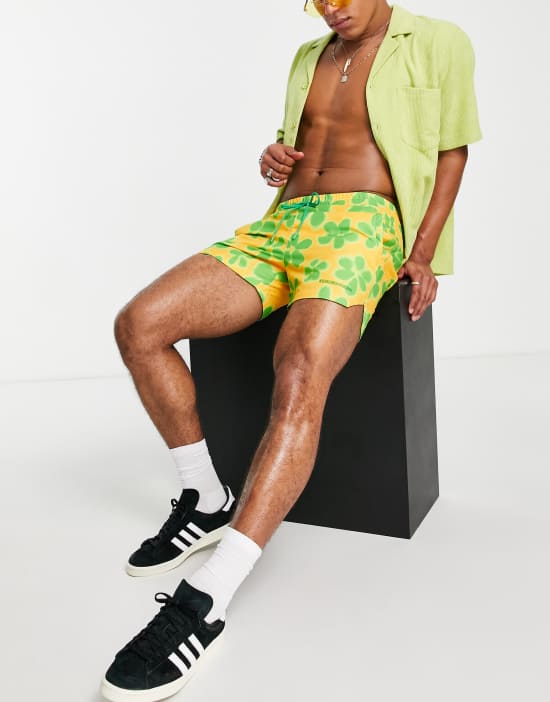 https://images.asos-media.com/products/reclaimed-vintage-inspired-unisex-swim-short-in-yellow-flower-print/201844105-4?$n_550w$&wid=550&fit=constrain