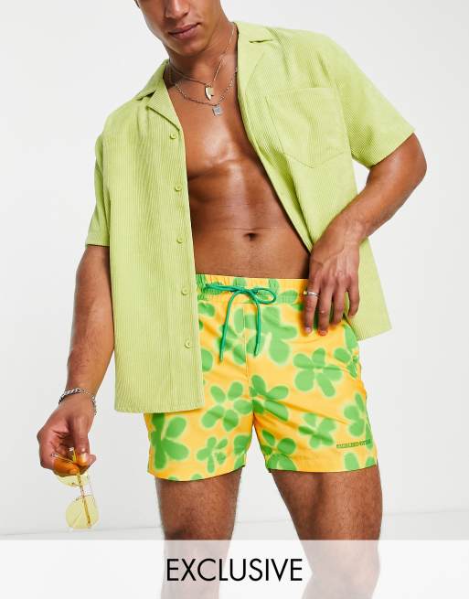 Reclaimed Vintage Inspired unisex swim shorts in yellow flower print