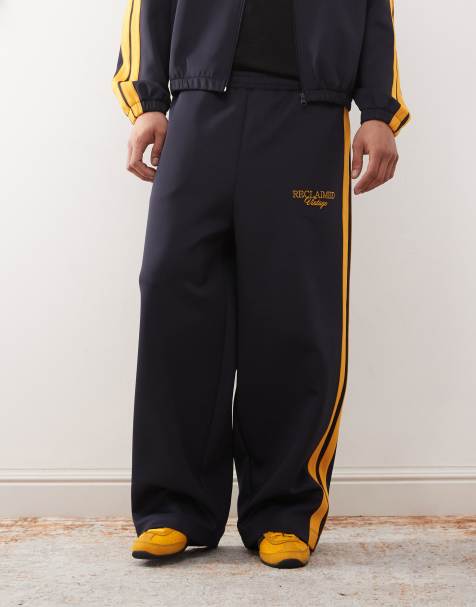 Reclaimed Vintage - Joggers a fondo ampio blu navy con righe laterali in coordinato - view 1