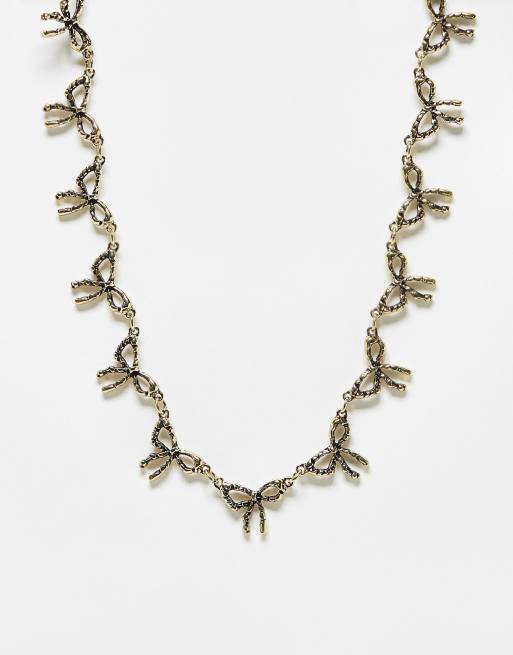 Reclaimed Vintage - Ketting met strikjes in gepolijst goud