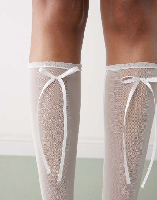 Reclaimed Vintage knee high mesh socks with white bow | ASOS