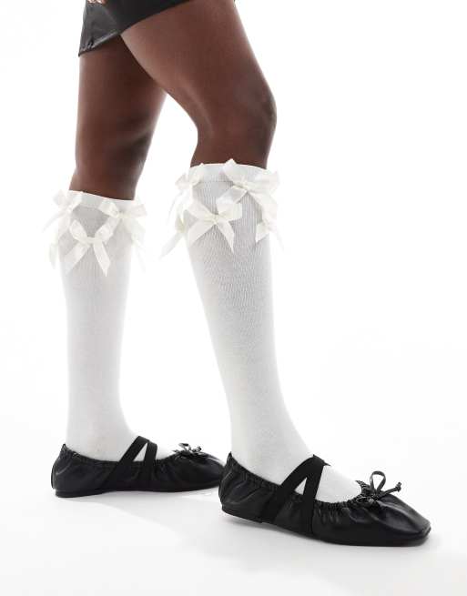 Reclaimed Vintage knee high socks with bows in white | ASOS