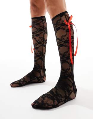 Reclaimed Vintage knee high socks with red bow in black lace