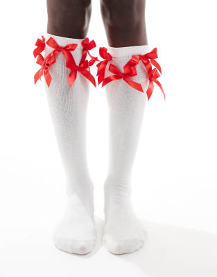 knee-high socks with red bows in white