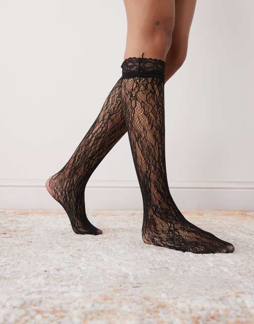 Reclaimed Vintage knee length lace socks with ruffles in black