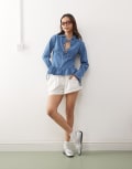 [Reclaimed Vintage] Reclaimed Vintage long sleeve denim tie front top with peplum hem in mid blue 4 Denim
