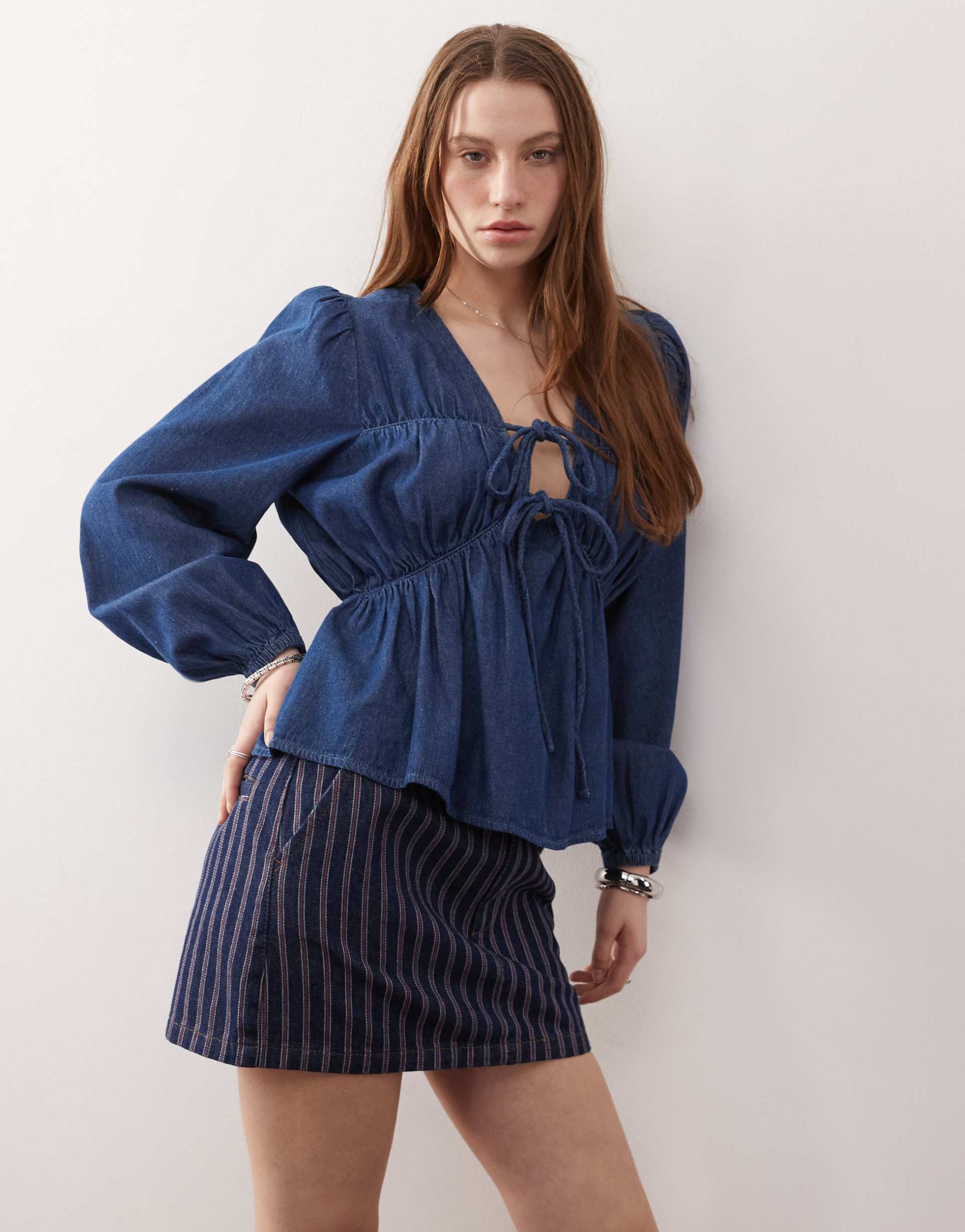reclaimed vintage long sleeve ruched tie front top in mid blue denim