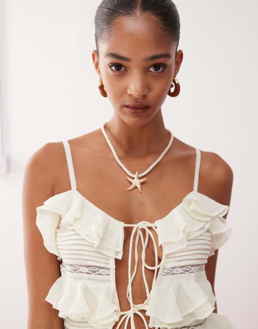 Reclaimed Vintage longline festival top with ruffles and tie front detail in cream