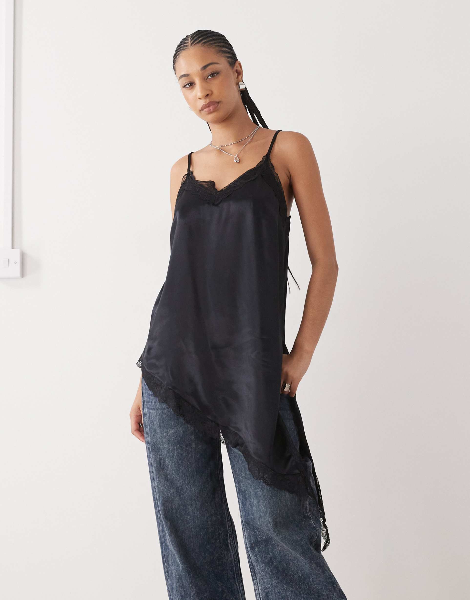 reclaimed vintage longline layering cami top with asymmetric hem and lace trim in black