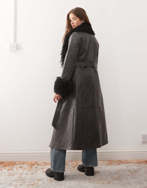 Reclaimed Vintage longline leather look trench coat with faux fur collar and cuffs in black