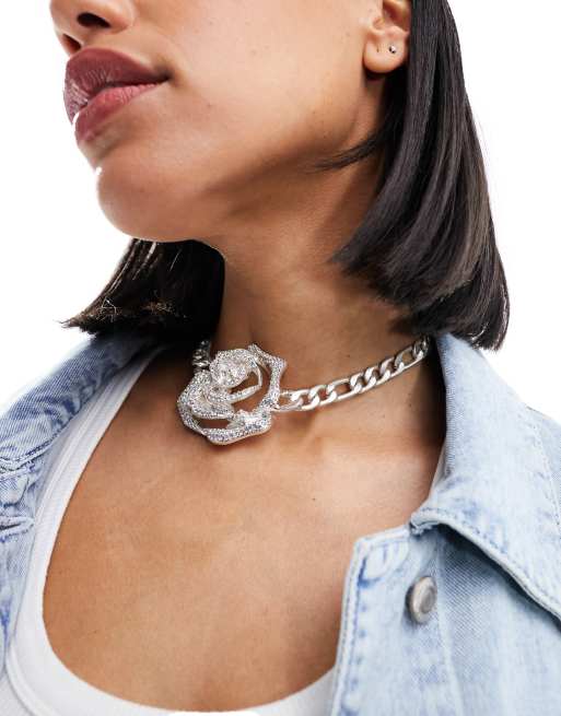 Metal rose top with necklace inside