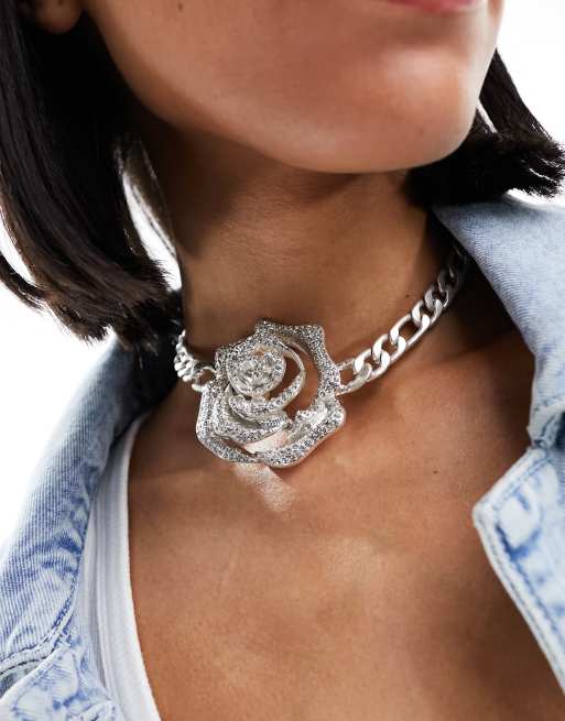 Metal rose top with necklace inside