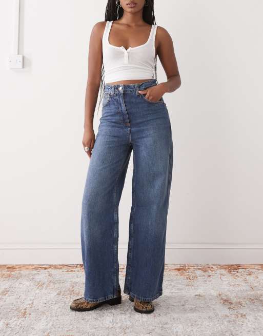 Reclaimed Vintage – Mellanblå, tvättade och baggy jeans i cowboystil