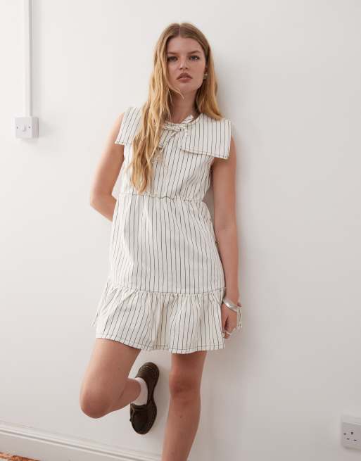 Reclaimed Vintage mini denim dress with sailor collar and frill hem in ecru pinstripes