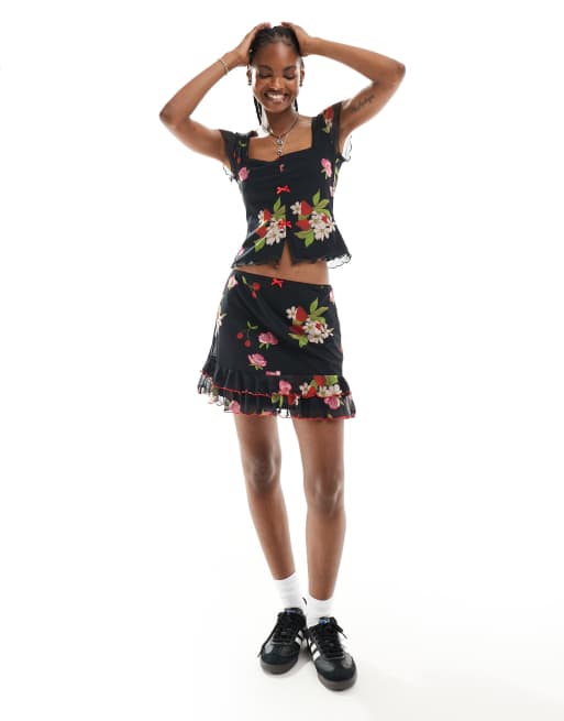 Reclaimed Vintage mini skirt with bows in black vintage floral and fruit print, 4 of 5