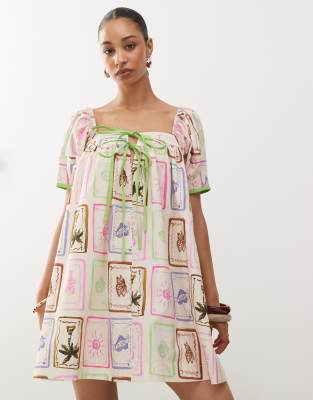 reclaimed vintage mini smock dress in bright postcard print with contrast trim