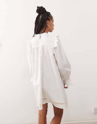 Reclaimed Vintage mini smock dress with inserted lace trims and ruffles in white