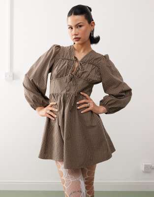 reclaimed vintage mini smock dress with tie front in brown plaid