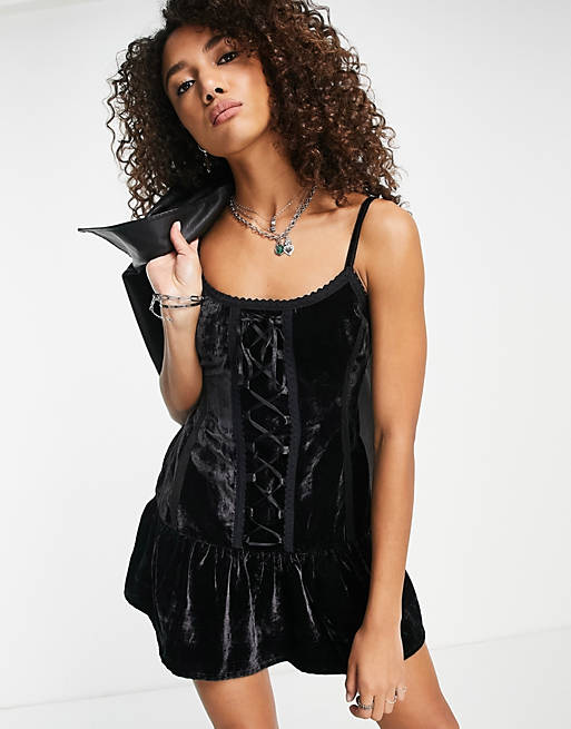 Reclaimed Vintage mini velvet corset dress in black with lace up detail