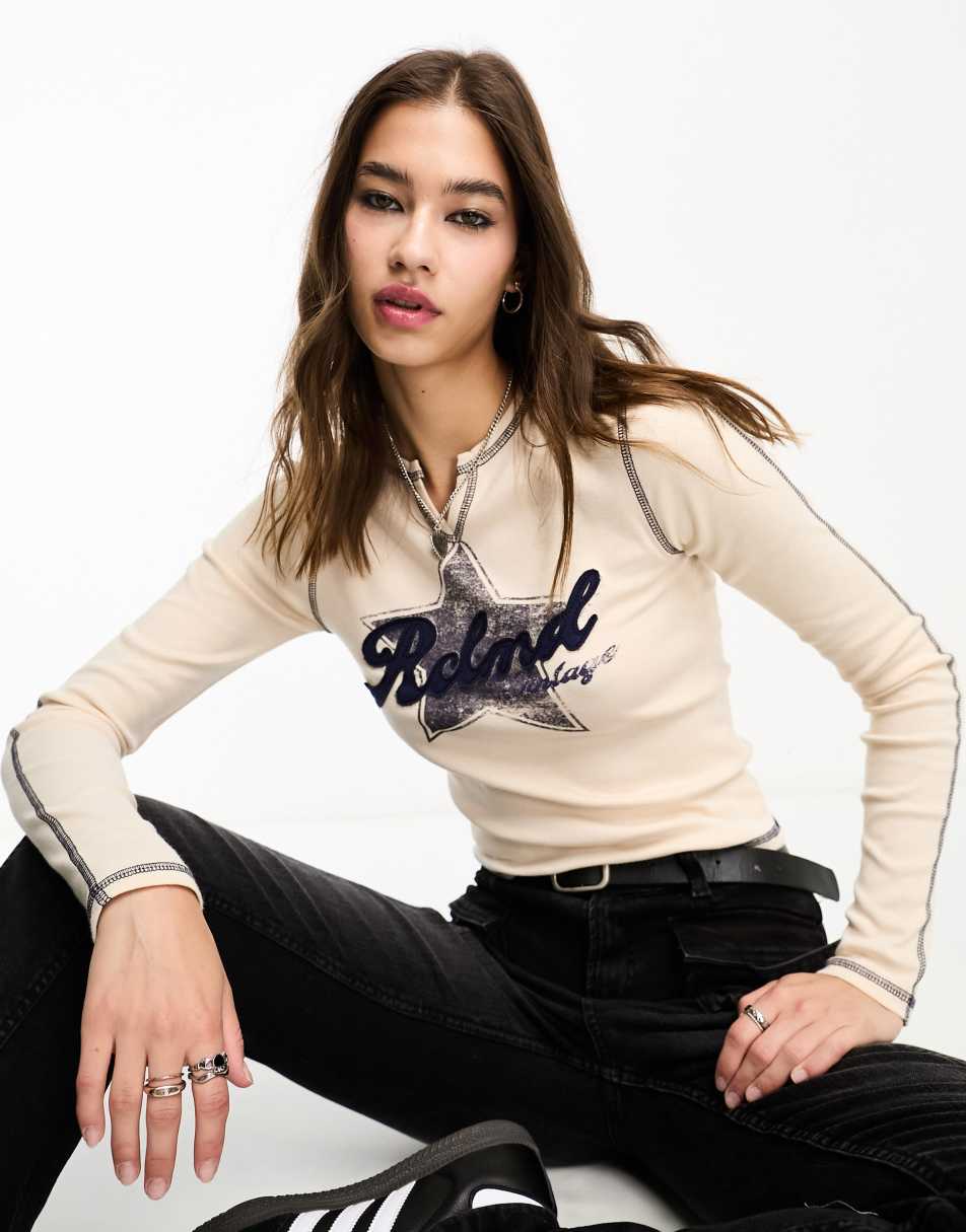 Reclaimed Vintage notch neck long sleeve star applique top