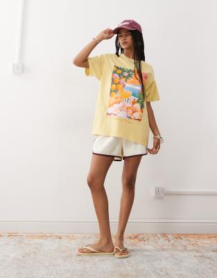 Reclaimed Vintage oversized cotton t-shirt with vacation print in washed yellow 