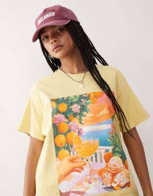 Reclaimed Vintage oversized cotton t-shirt with vacation print in washed yellow 