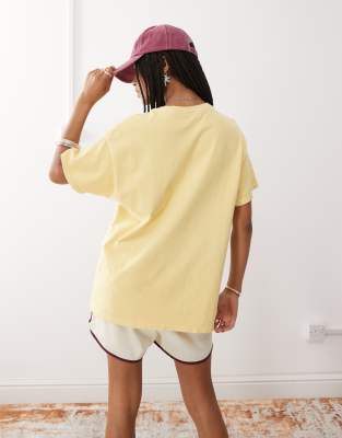 Reclaimed Vintage oversized cotton t-shirt with vacation print in washed yellow 