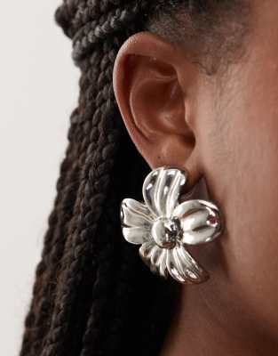 oversized flower earrings in silver tone