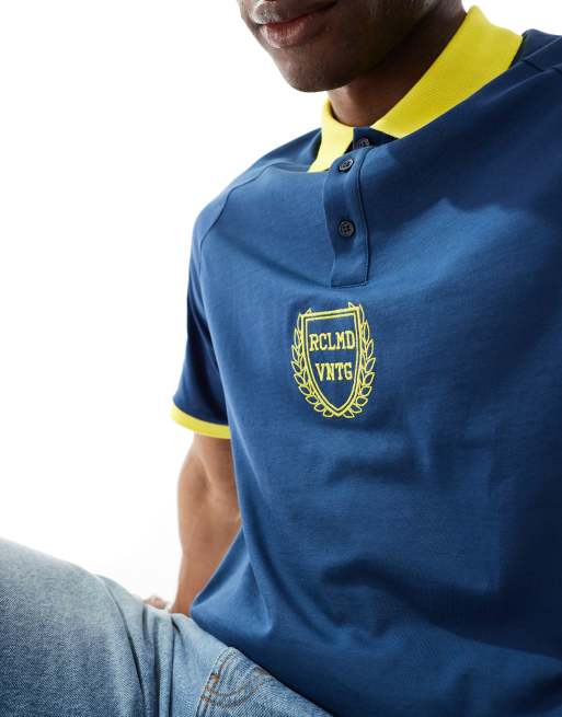 Reclaimed Vintage oversized sports polo top in navy and