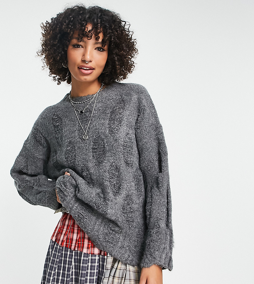 oversized sweater with laddering and distressing in gray