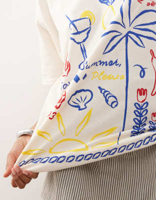 Reclaimed Vintage oversized t-shirt with holiday doodle print in butter yellow
