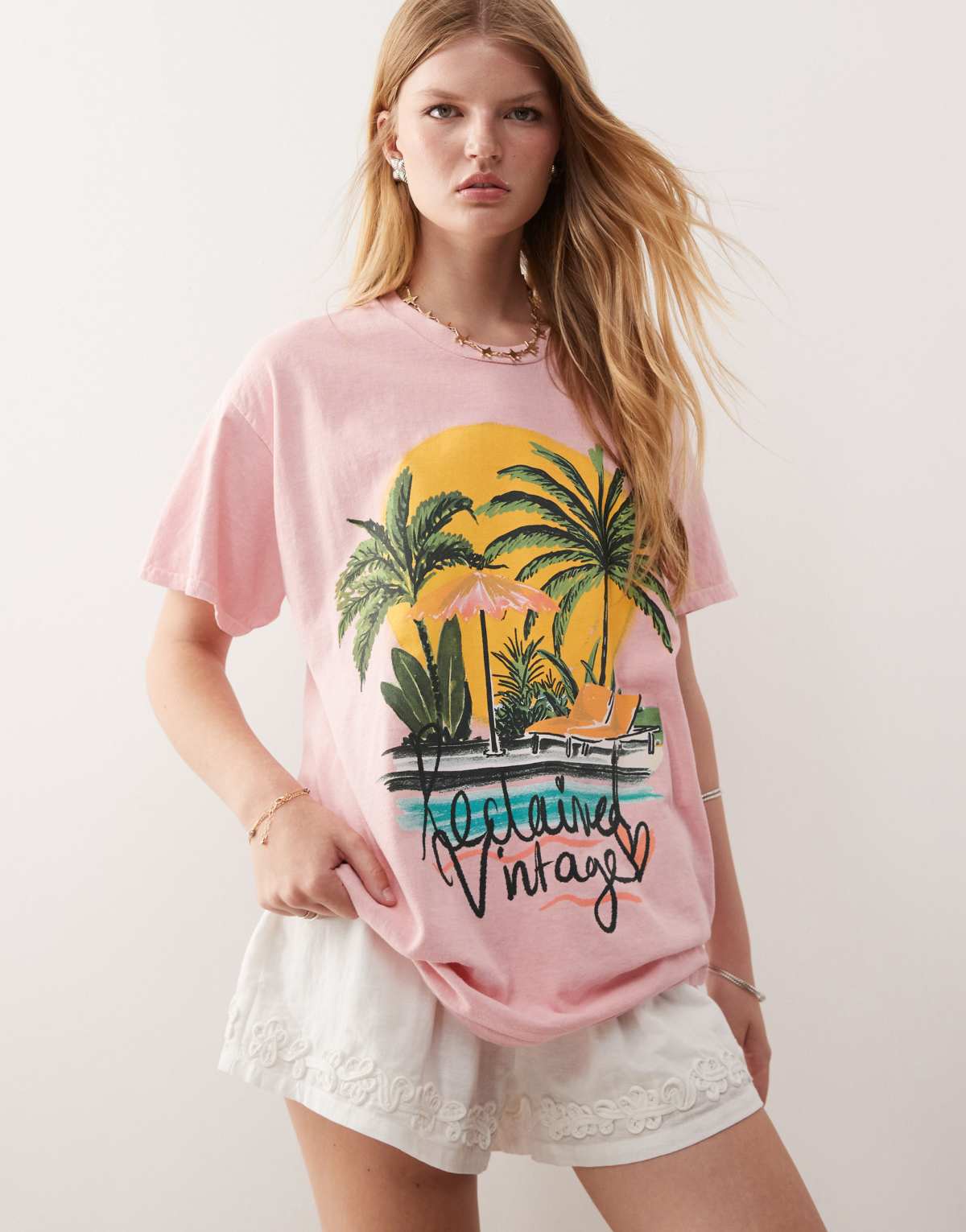 Reclaimed Vintage oversized t-shirt with palm tree holiday print in pink