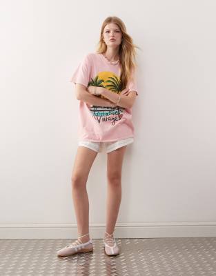 Reclaimed Vintage oversized t-shirt with palm tree holiday print in pink