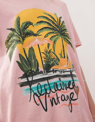 Reclaimed Vintage oversized t-shirt with palm tree holiday print in pink