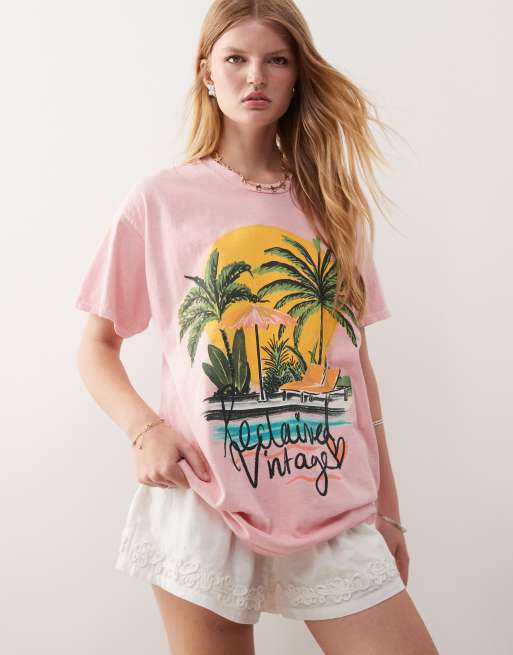 Reclaimed Vintage oversized t-shirt with palm tree vacation print in pink