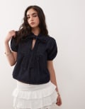 [Reclaimed Vintage] Reclaimed Vintage puff sleeve tie neck denim top in light indigo wash-Blue S Light Indigo