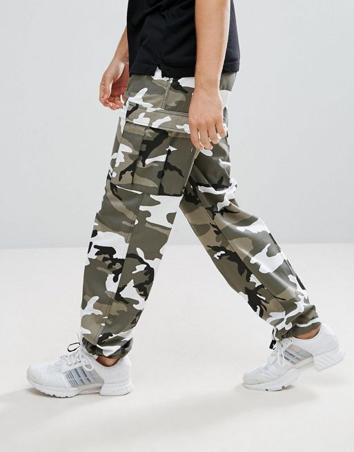 Reclaimed Vintage Revived Camo Cargo Trousers In Orange, $42, Asos
