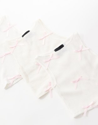 RECLAIMED VINTAGE REVIVED X GLASS ONION CROPPED TANK TOP WITH BOWS-WHITE 