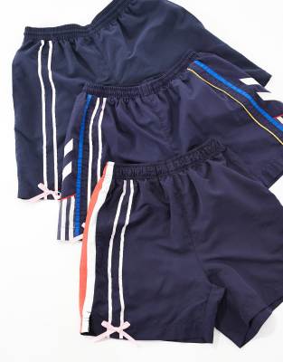 Reclaimed Vintage Revived x Glass Onion track shorts with bow & ribbon detail in blue