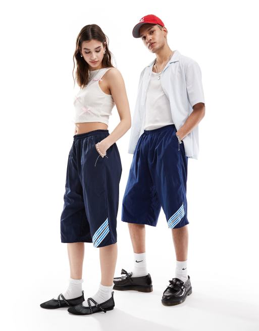 Reclaimed Vintage Revived x Glass Onion unisex longline track short with taping detail