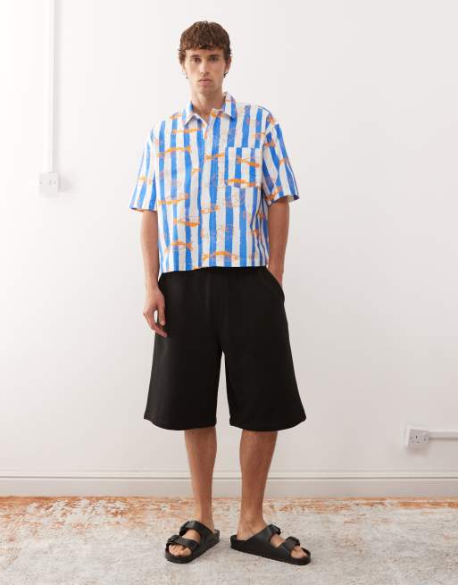 Reclaimed Vintage short sleeve boxy shirt in blue and white stripes with fish print