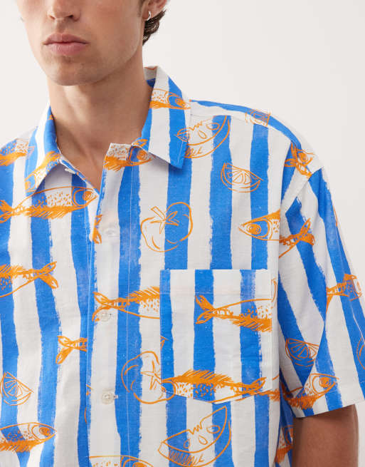Reclaimed Vintage short sleeve boxy shirt in blue and white stripes with fish print
