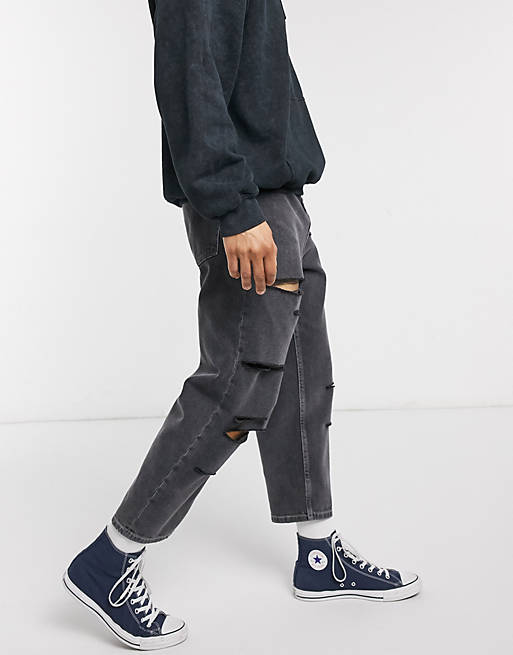 Reclaimed Vintage skater fit jeans with distressing in black wash | ASOS
